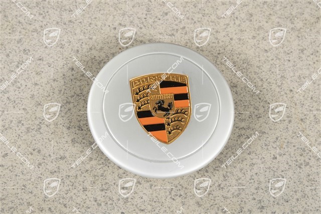 Dekielek koła, do średnicy wewnętrznej 66 mm, do felg Fuchs, anodowany, srebrny z kolorowym, wytłoczonym herbem Porsche (pomarańczowy)